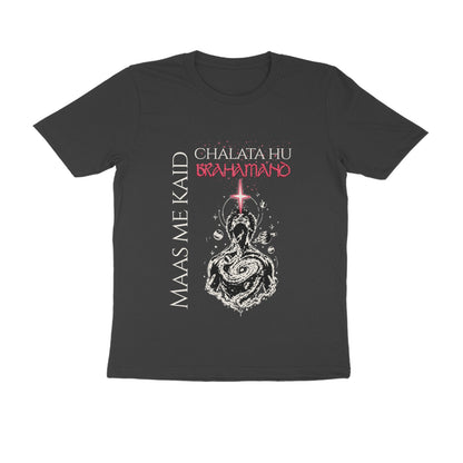 A dark charcoal gray short-sleeve t-shirt with a graphic print on the front. The graphic features the text 'MAAS ME KAI'D' in white vertical lettering on the left, 'CHALATA HU BRAHMANO' in white and red at the top, and a white line-art illustration of a seated figure with a glowing red cross on the chest.